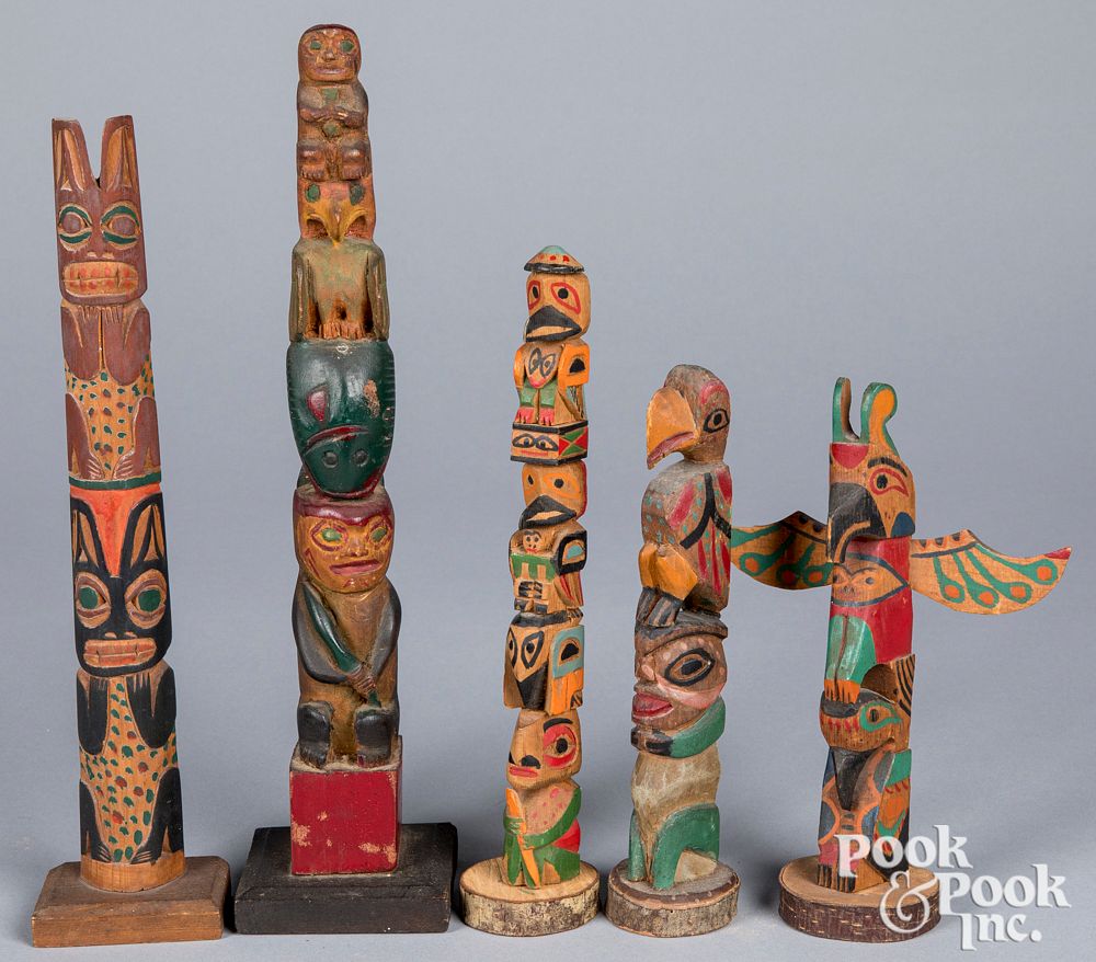 Appraisal: Five Northwest Coast carved painted totem poles Group of Northwest