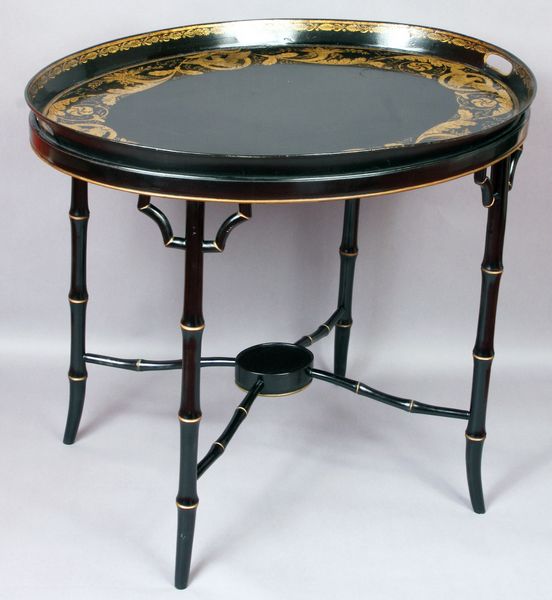 Appraisal: Black and gold painted tole tray table having eagle design