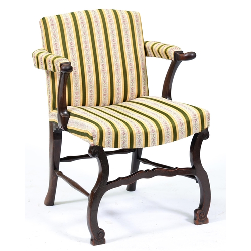 Appraisal: A George II mahogany elbow chair with dished seat on