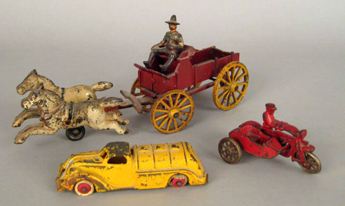 Appraisal: Cast iron horse and wagon toy together with a motorcycle