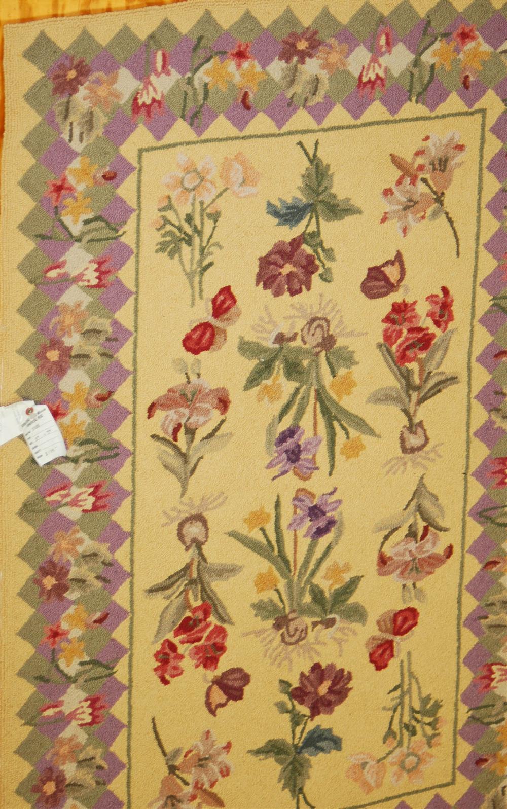 Appraisal: CHINESE WOOL HOOKED RUG having a center floral spray design