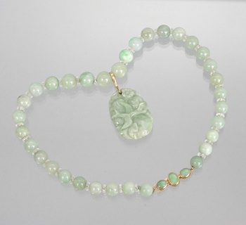 Appraisal: A Jade Bead Necklace with Pendant Chinese The necklace is