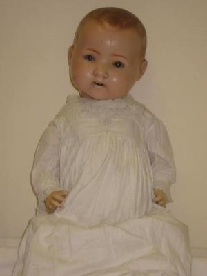 Appraisal: A German composition baby doll with brown glass sleeping eyes