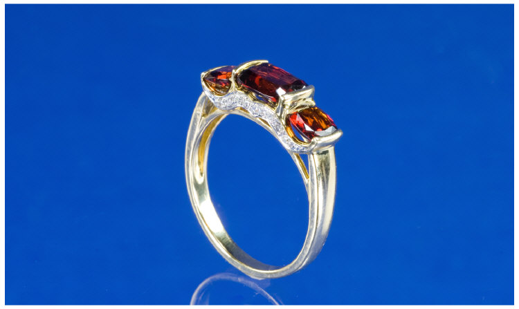 Appraisal: ct Gold Garnet And Diamond Ring Three Stone Garnet Ring