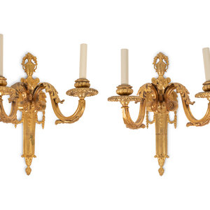 Appraisal: A Pair of Louis XVI Style Gilt Bronze Two-Light Sconces