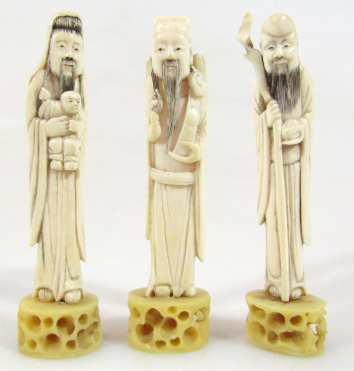 Appraisal: A set of three thC ivory figures of sages each