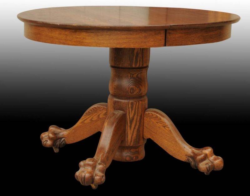 Appraisal: Oak Round Table with Claw Feet Description Circa Includes three