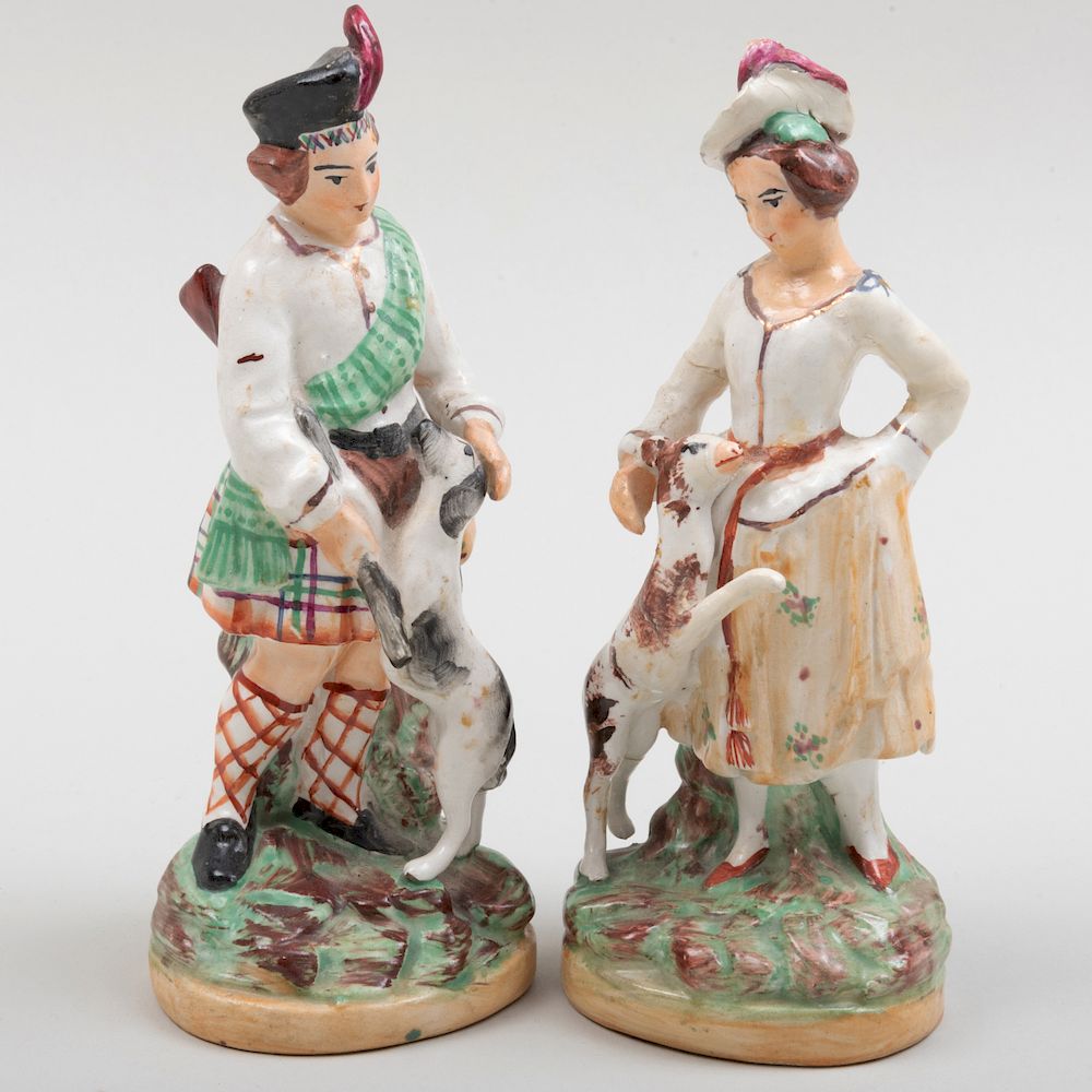 Appraisal: Pair of Staffordshire Figures of a Hunter and Companion Printed