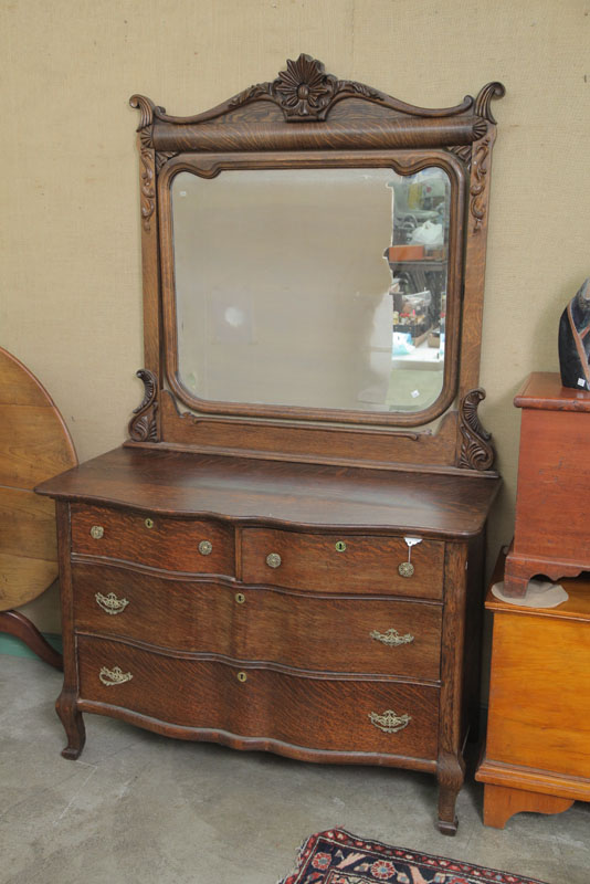 Appraisal: CHEST OF DRAWERS WITH MIRROR Oak with a carved crest