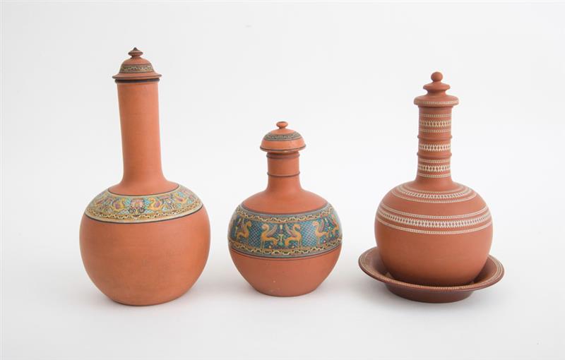 Appraisal: THREE ENGLISH DECORATED TERRACOTTA WATER BOTTLES Circa x in Estimate