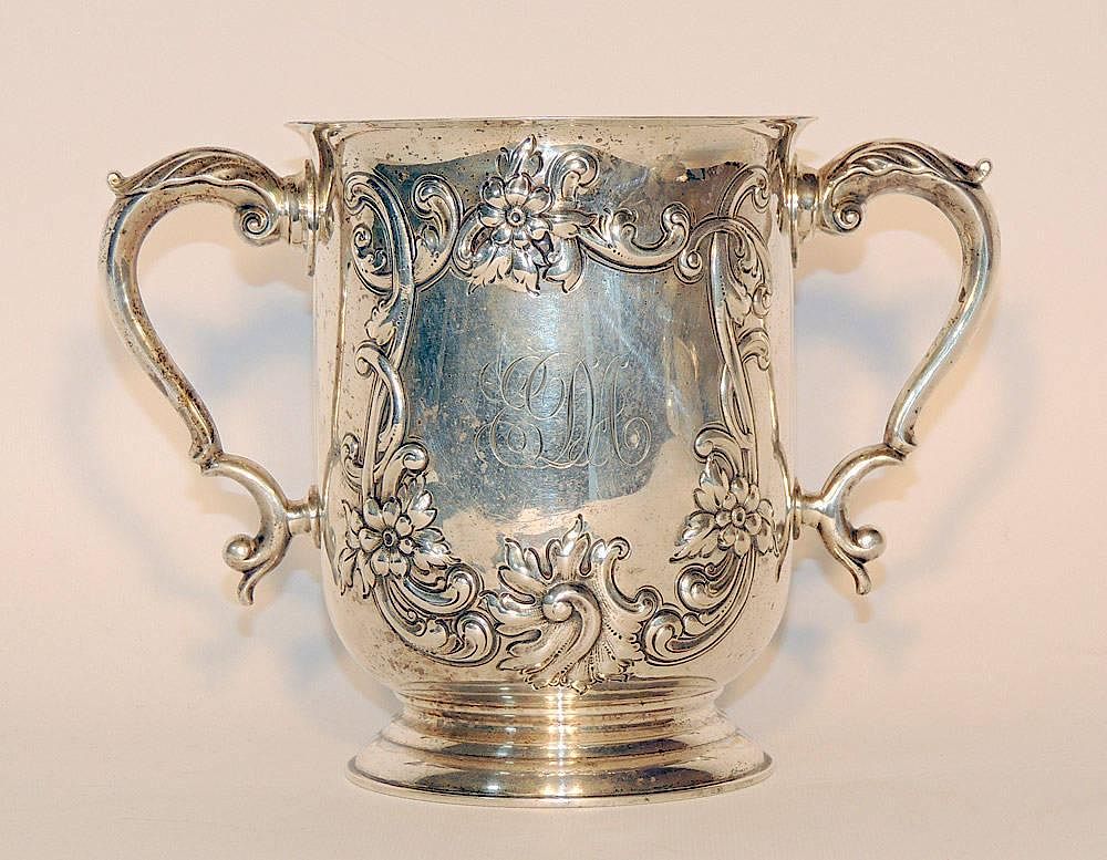 Appraisal: Sterling Two-Handled Cup With repouss foliate decoration tall x -