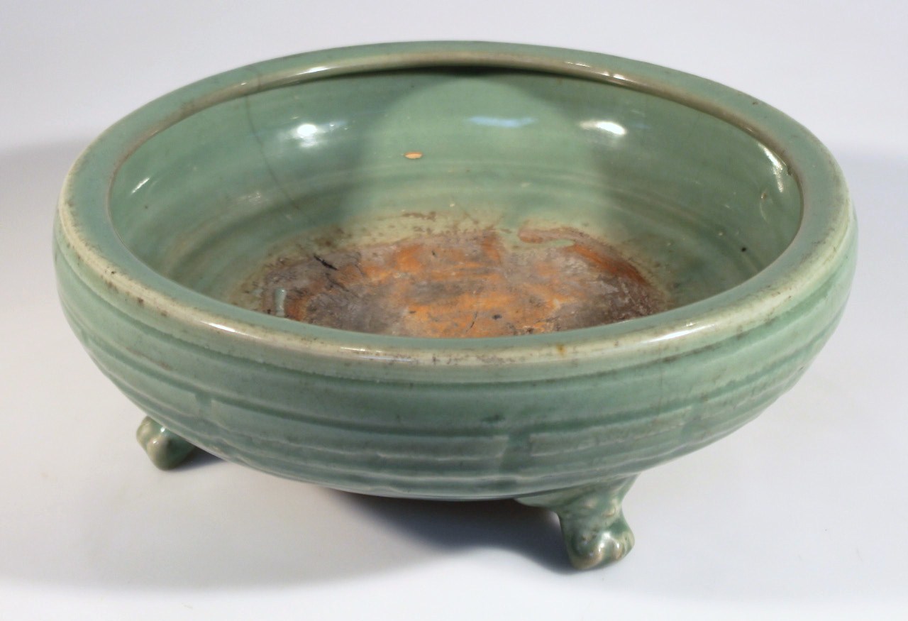 Appraisal: A Chinese celadon earthenware bowl the circular body with a