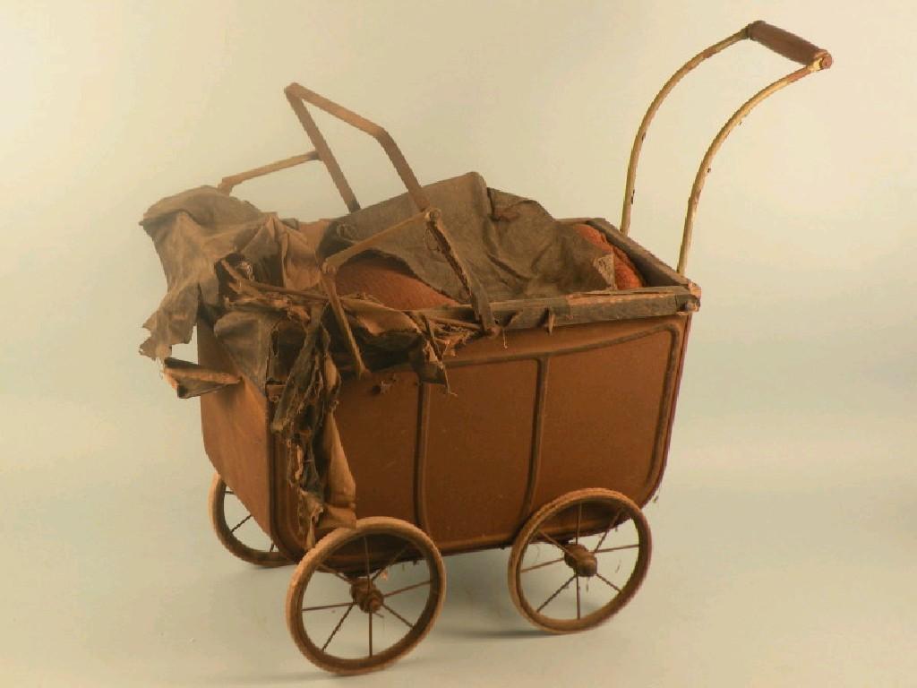 Appraisal: A late thC child's painted iron doll's pram with canvas