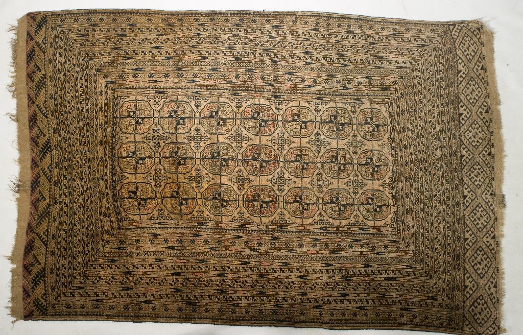 Appraisal: TURKEMAN TEKKE RUG EARLY th CENTURY with twenty-one central medallions