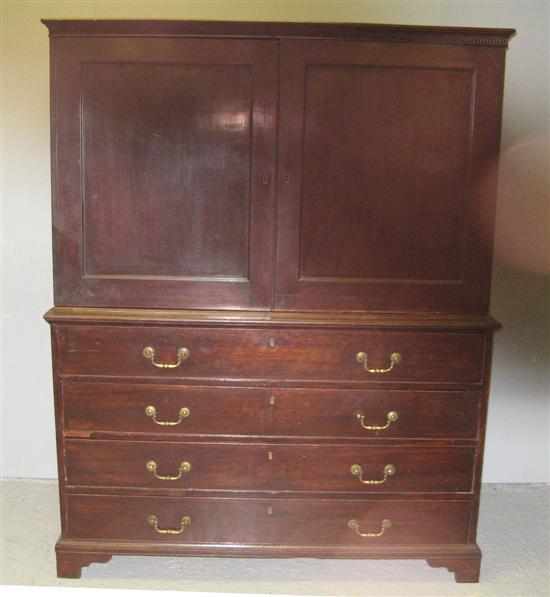 Appraisal: th century mahogany linen press with two cupboard doors enclosing