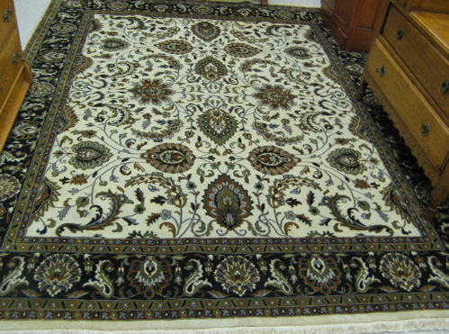 Appraisal: HAND KNOTTED ORIENTAL CARPET Indo-Persian overall floral arabesque decoration on