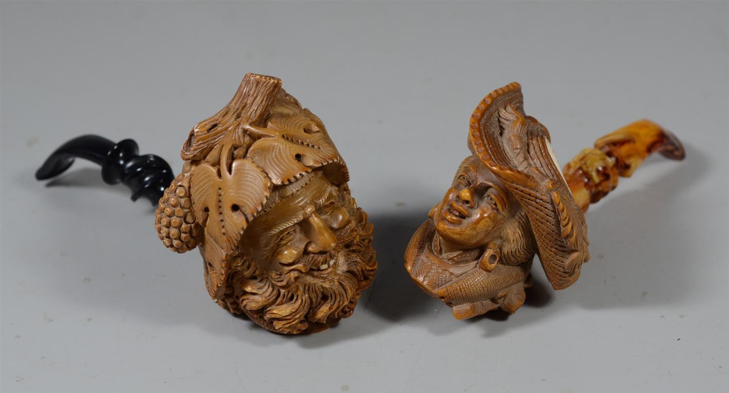 Appraisal: Group of figural carved Meerschaum pipes mountain man with leaf