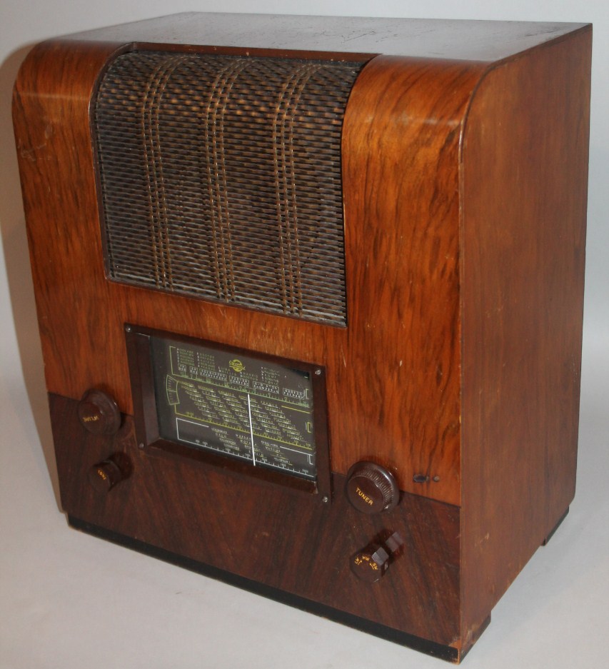 Appraisal: A mid- thC Marconi walnut cased radio with front articulated