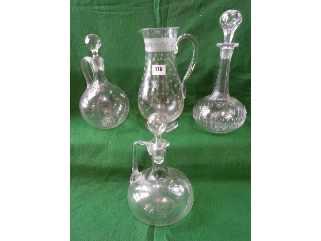 Appraisal: Three glass decanters of varied sizes and a water jug