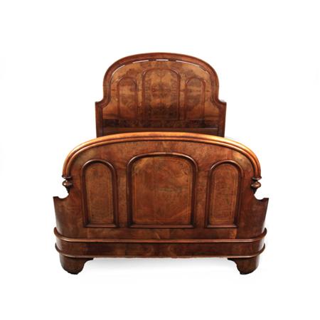 Appraisal: A Victorian walnut double bed the boxwood strung moulded arched