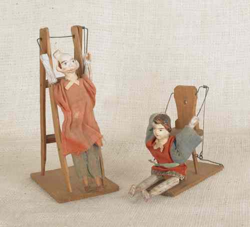 Appraisal: Two composition acrobat toys th c tallest -