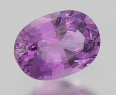 Appraisal: An Unmounted Purple Sapphire Oval faceted cut weighting carat Origin