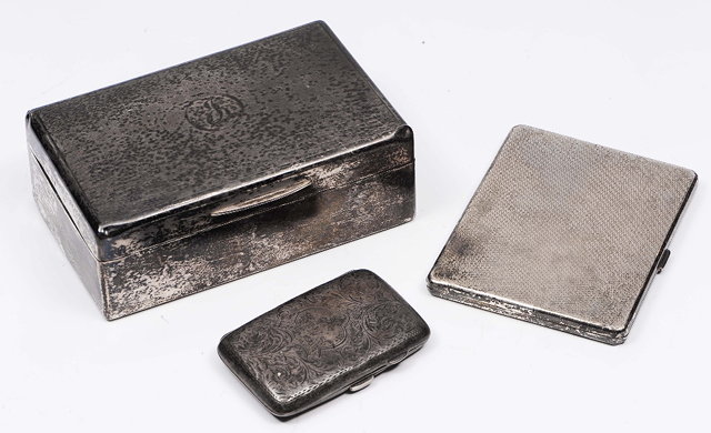 Appraisal: A silver cigarette boxof plain form monogrammed together with a