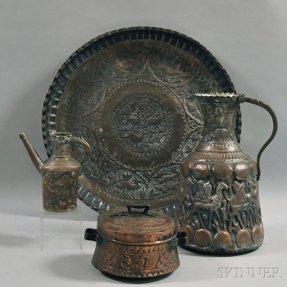 Appraisal: Four Persian Molded and Tinned Copper Objects a large pitcher