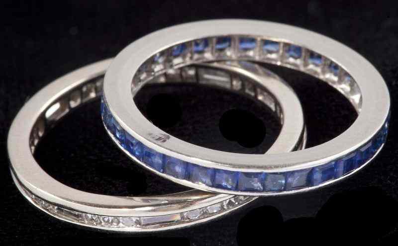 Appraisal: Two Eternity Bandsthe first set with caliber cut square sapphires