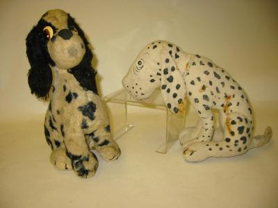 Appraisal: A Merrythought seated spaniel covered in black and white spotted