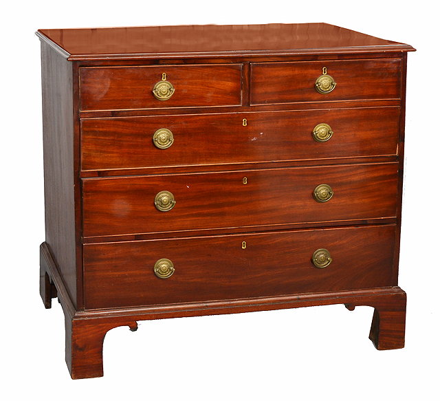 Appraisal: A LATE GEORGIAN MAHOGANY STRAIGHT FRONT CHEST of two short