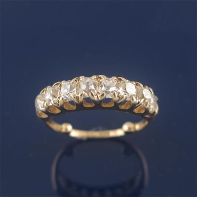 Appraisal: A diamond half hoop ring the old mine cut diamonds