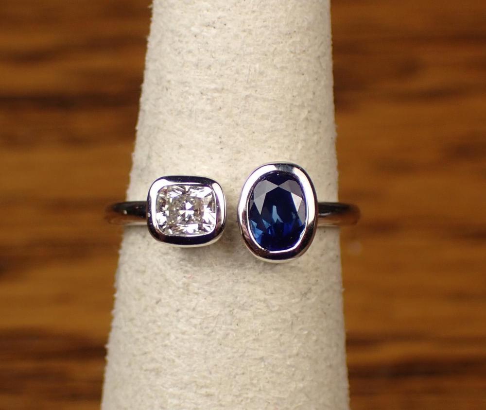 Appraisal: DIAMOND SAPPHIRE AND FOURTEEN KARAT GOLD RING The white gold