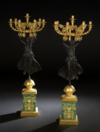 Appraisal: Monumental Pair of Seven-Light Nike Candelabra composed of richly parcel-gilded