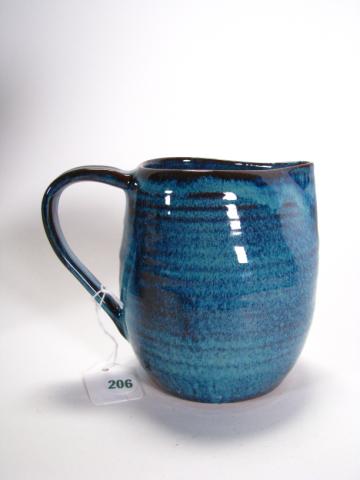 Appraisal: Martz Studio handled pitcher terra cotta with blue glaze tall