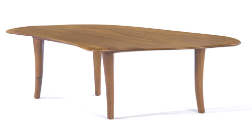 Appraisal: WHARTON ESHERICK Walnut coffee table with free-form top on splayed