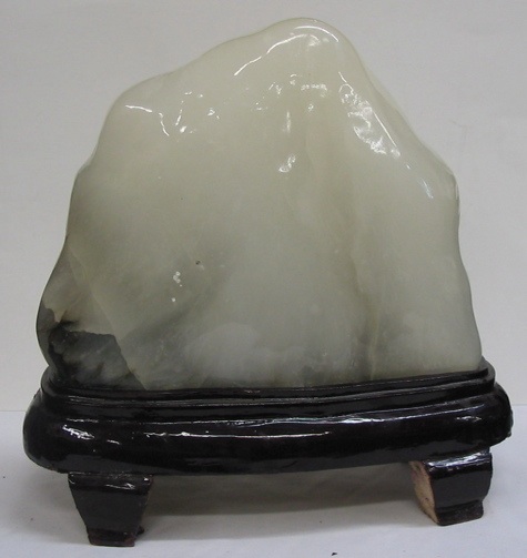 Appraisal: A NATURAL JADE STONE MOUNTAIN with natural black and gray