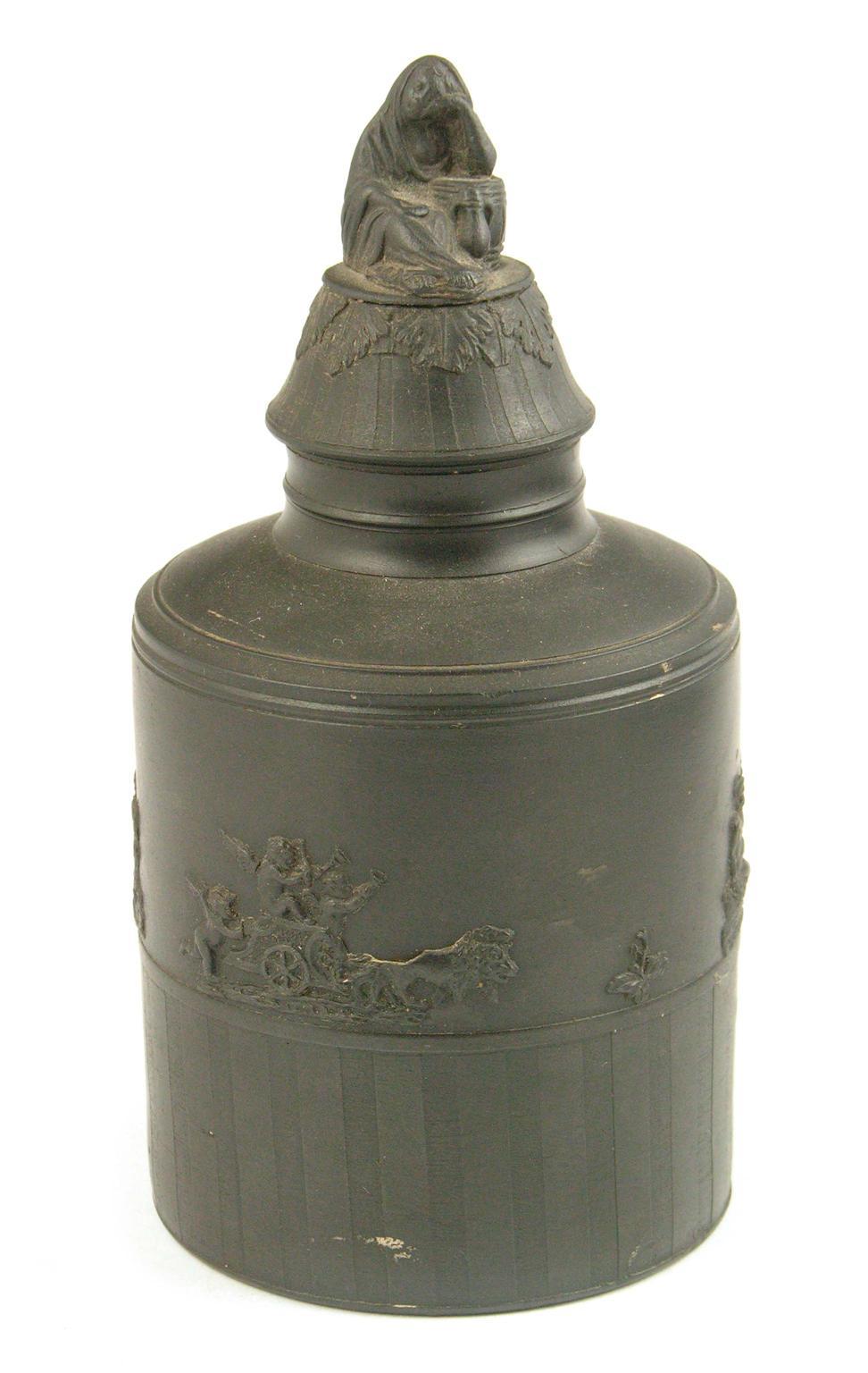 Appraisal: A black basalt cylindrical tea canister