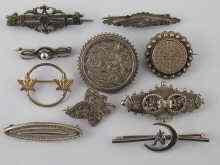 Appraisal: A mixed lot comprising ten white metal tests silver lapel