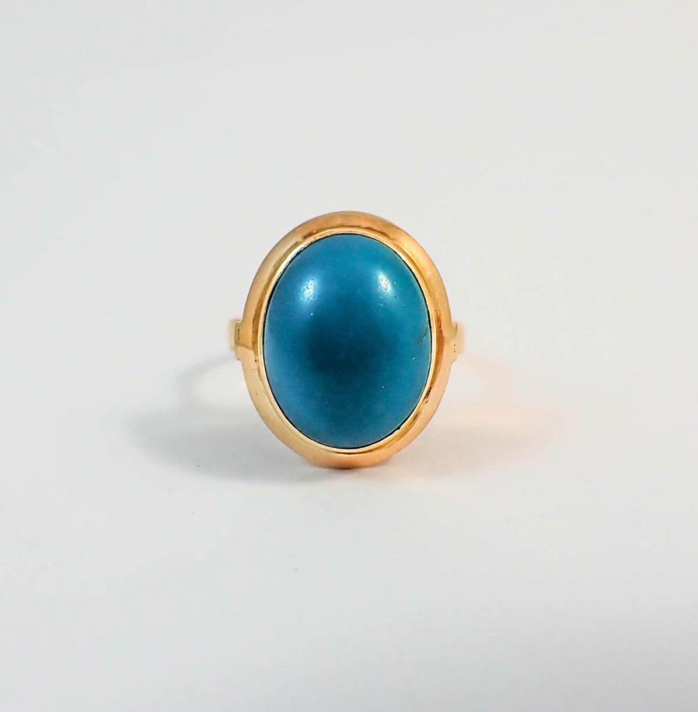 Appraisal: TURQUOISE AND FOURTEEN KARAT GOLD RING bezel set with a