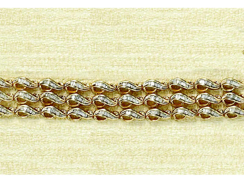 Appraisal: DIAMOND BRACELET k yellow gold wave links of three rows