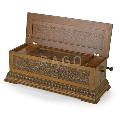 Appraisal: JACOT SWISS MUSIC BOX Oak chip-carved case six tune ca