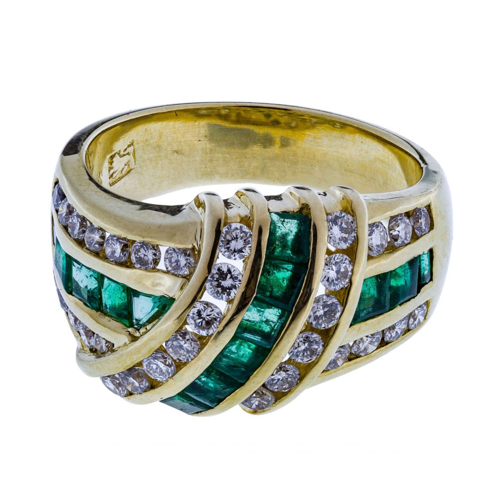 Appraisal: K YELLOW GOLD EMERALD AND DIAMOND RINGHaving princess cut emeralds