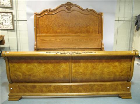 Appraisal: KING-SIZED SLEIGH BED th century the oversized headboard with decorative