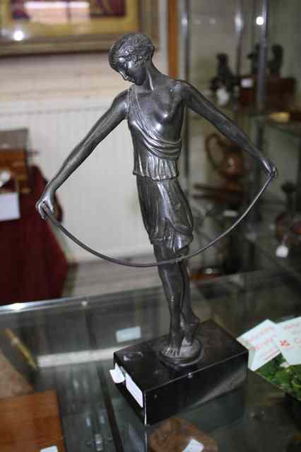 Appraisal: AN ART DECO STYLE BRONZE FIGURE of a girl in