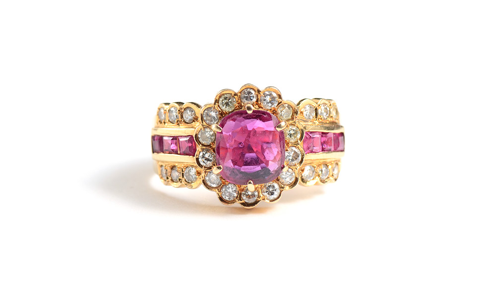 Appraisal: A FESTIVE RUBY AND DIAMOND RING K yellow gold ring