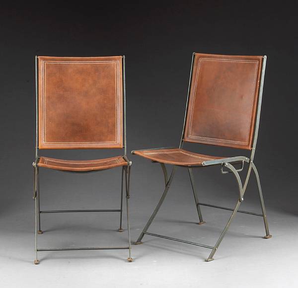 Appraisal: A set of twelve Italian steel and leather campaign chairs