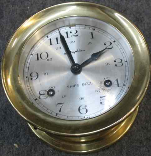 Appraisal: GERMAN SHIP'S CLOCK The circular brass cased clock having time