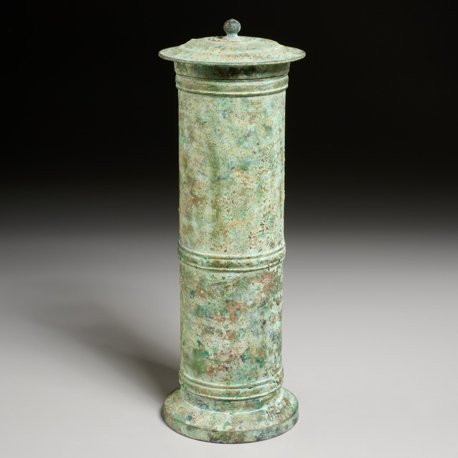 Appraisal: ASIAN ARCHAIC STYLE VERDIGRIS BRONZE CONTAINER Possibly Chinese cylindrical lidded