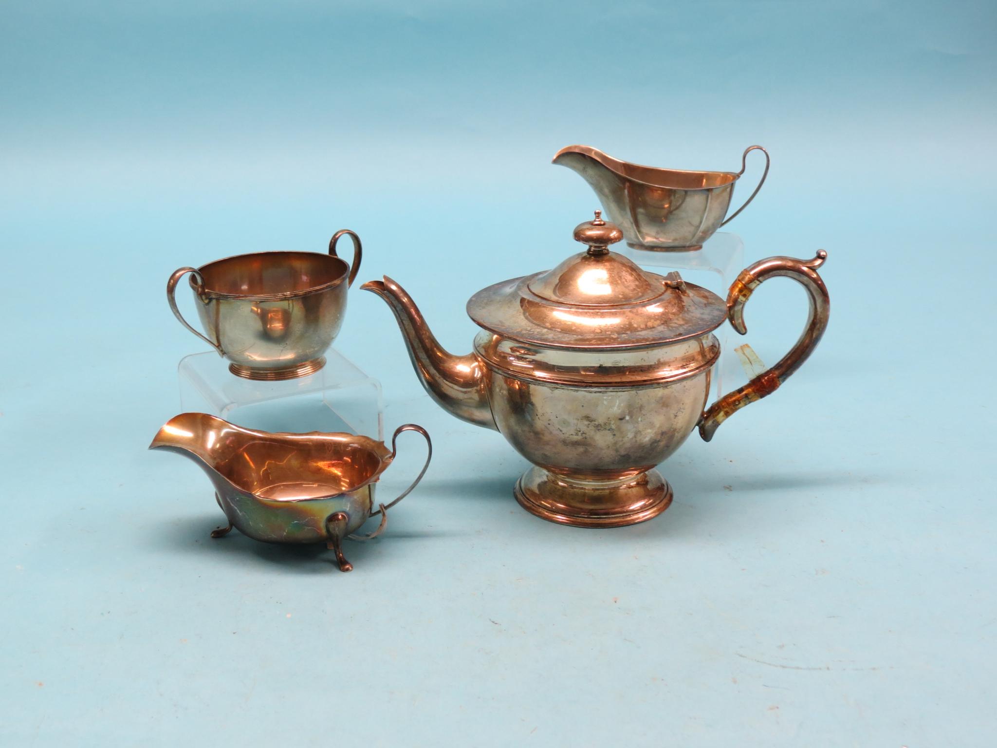 Appraisal: A silver teapot Birmingham two silver sauce jugs and a